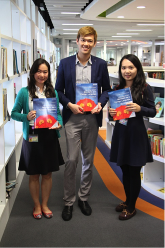 The authors of the Cambridge IGCSE Mandarin as a foreign language series pose with their book 